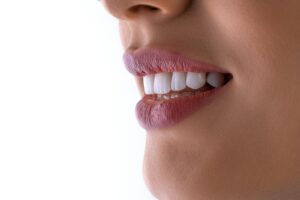 Close-up of a bright, white smile representing teeth whitening and enamel health