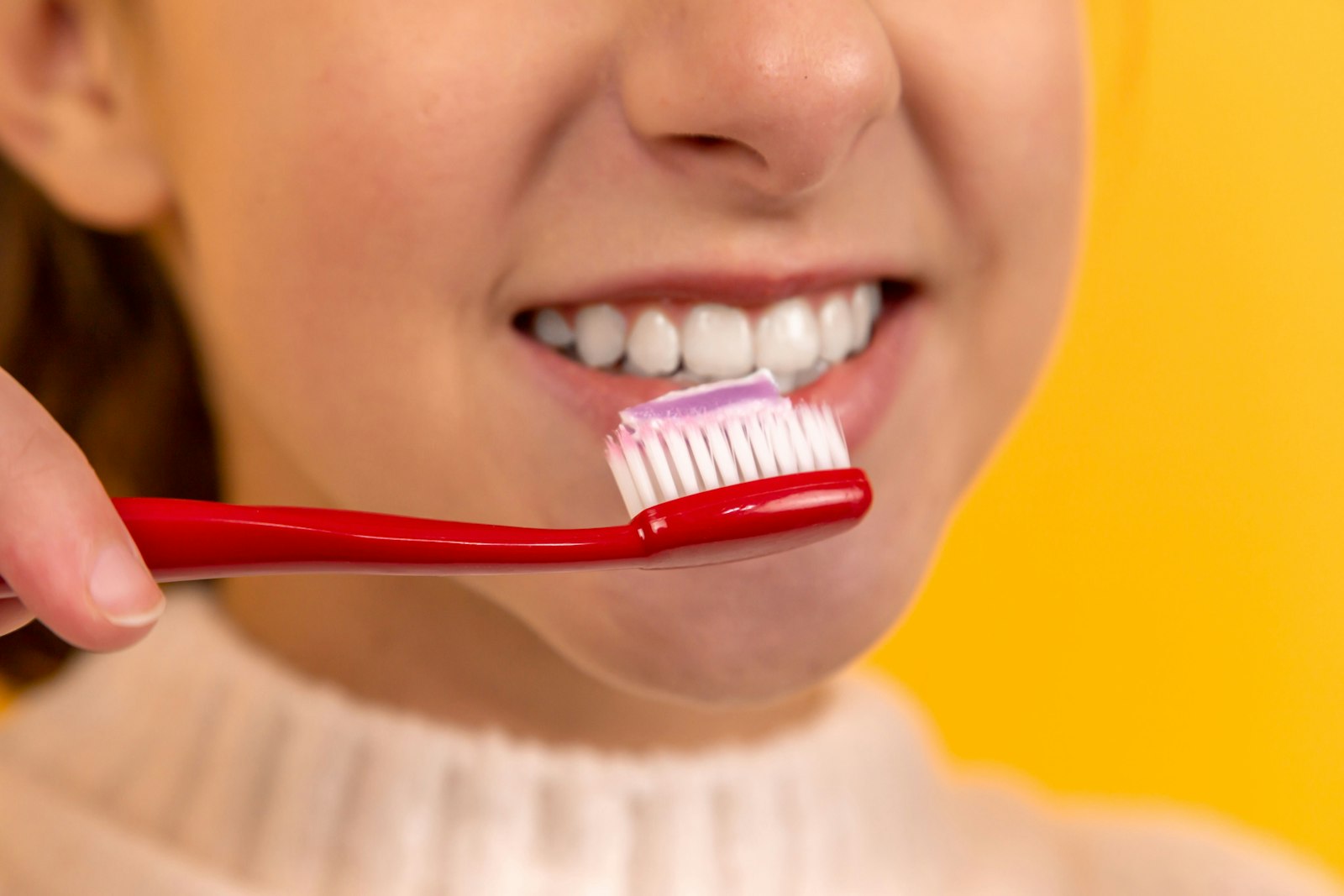 Oral Probiotics vs. Mouthwash: Which One Actually Fixes Bad Breath? 1 Close-up of a person brushing teeth, representing a daily oral hygiene routine and mouthwash use