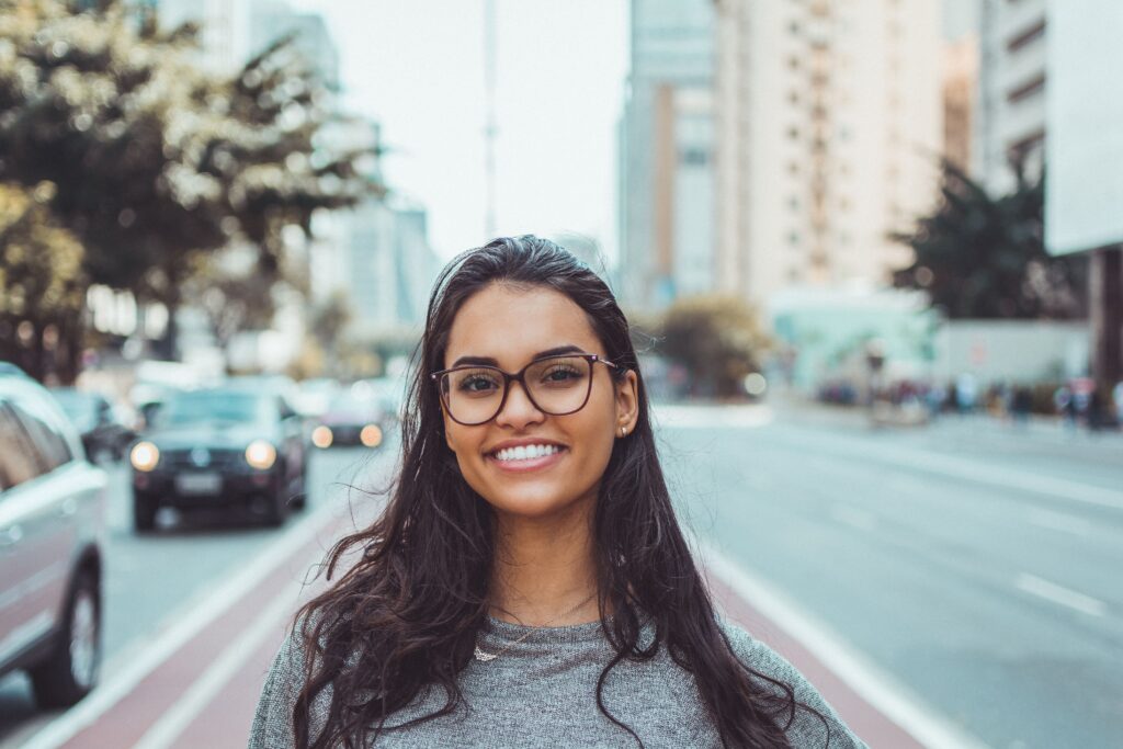 Young woman with bright white teeth and beautiful smile representing fresh breath and oral health