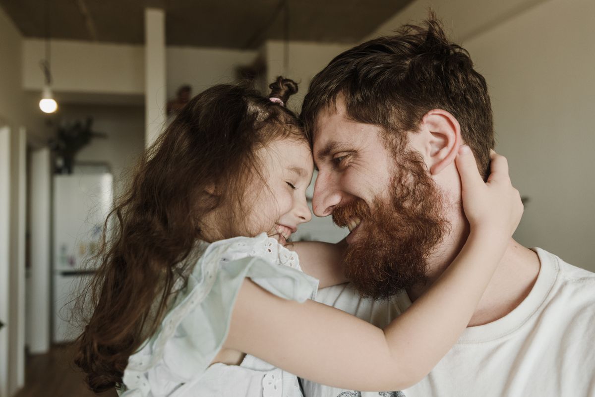 When Your Kids Pull Away (The Bad Breath Nobody in Your Family Will Mention) 1 Father embracing his daughter warmly, showing the family closeness that returns when bad breath is no longer in the way