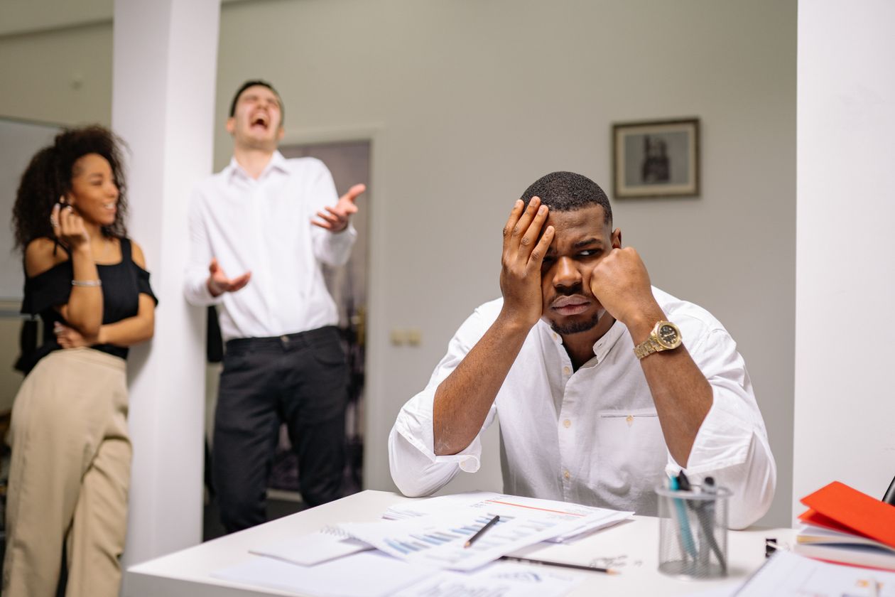 Businessman looking troubled and withdrawn, contemplating internal struggle and self-doubt