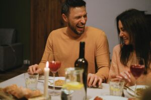 Man and woman laughing together up close, relaxed and confident without worry