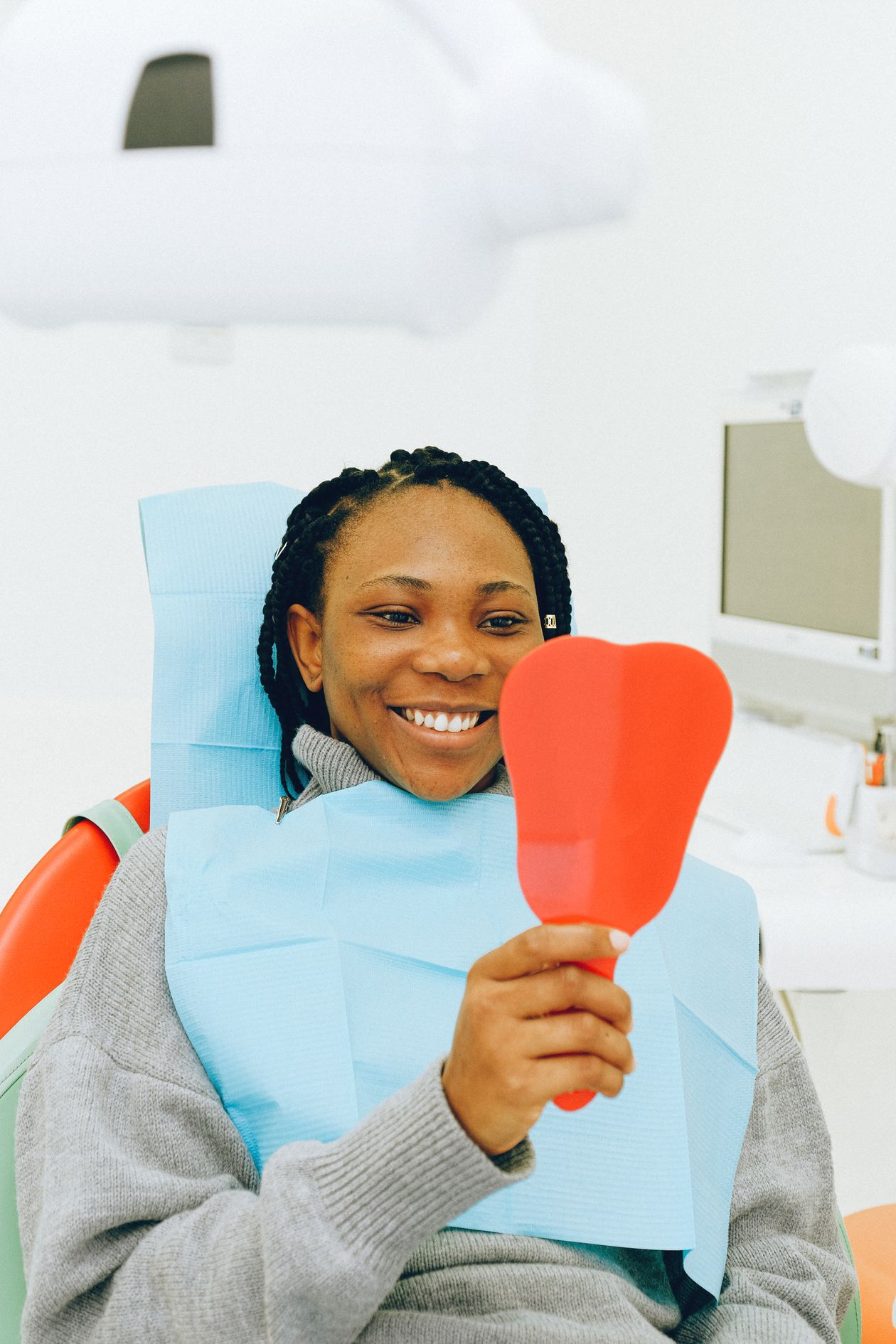 Best Probiotics for Oral Health 1 Woman looking in the bathroom mirror as part of her daily oral care routine