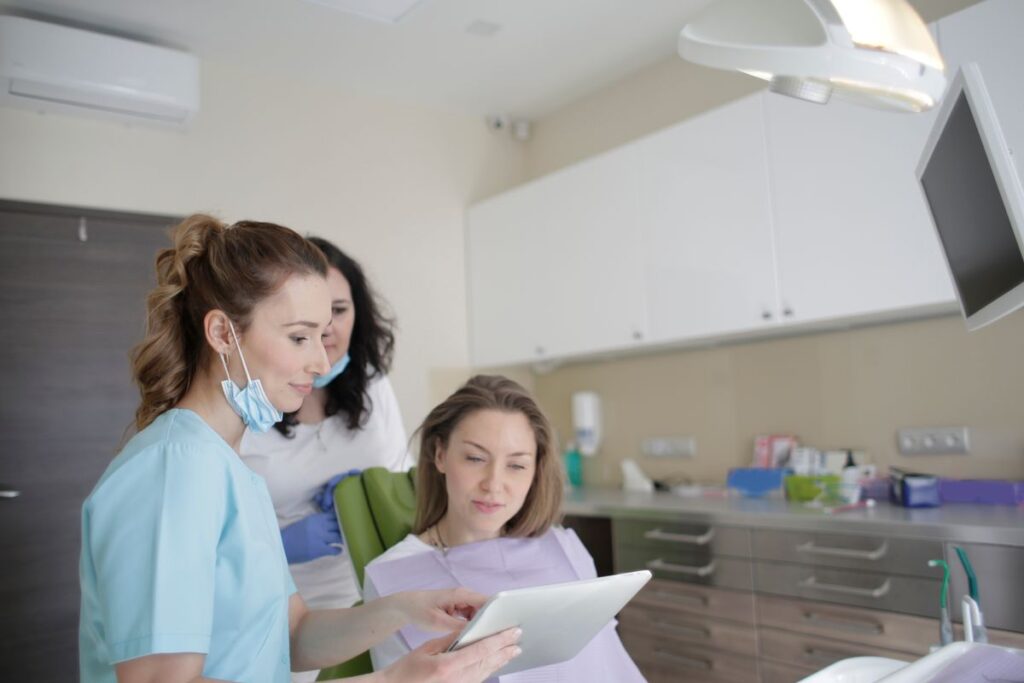 Dental team talking calmly with a patient who was too embarrassed to go to the dentist