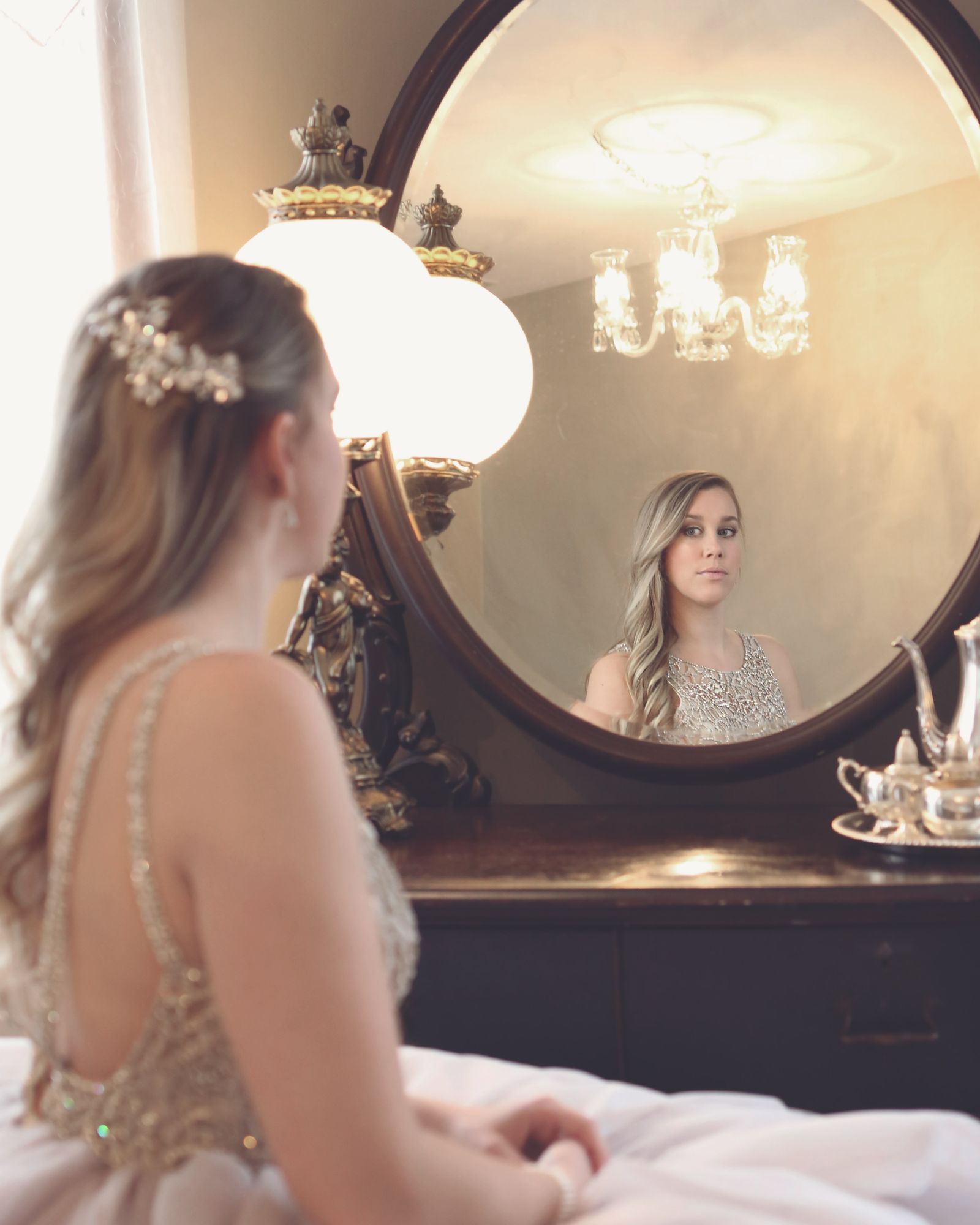 Woman looking at herself in the mirror before a date, worried about bad breath when dating again after divorce